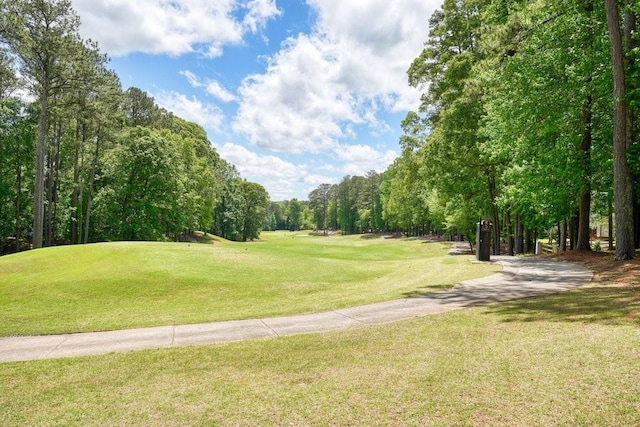 921 Laurel Crest Dr, Woodstock, GA 30189 - view of community with view of golf course, a lawn, and view of scattered trees