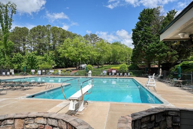 921 Laurel Crest Dr, Woodstock, GA 30189 - community pool with view of wooded area and a patio