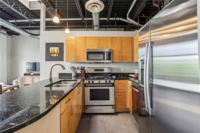 5200 Peachtree Rd Unit 3420, Atlanta, GA 30341 - kitchen with appliances with stainless steel finishes, dark stone counters, a peninsula, and decorative light fixtures