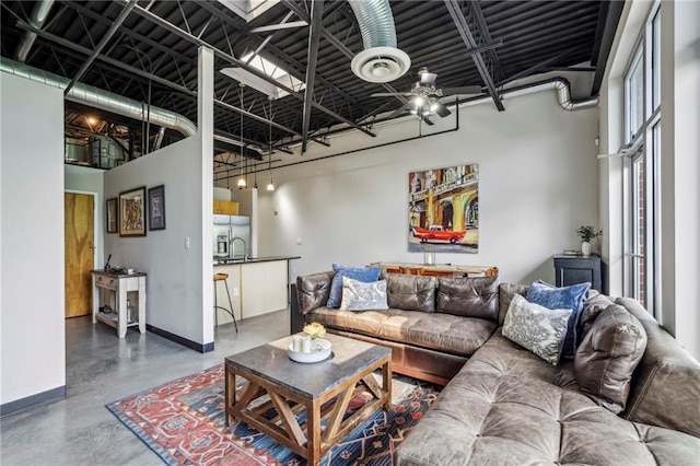 5200 Peachtree Rd Unit 3420, Atlanta, GA 30341 - living area featuring finished concrete floors and baseboards
