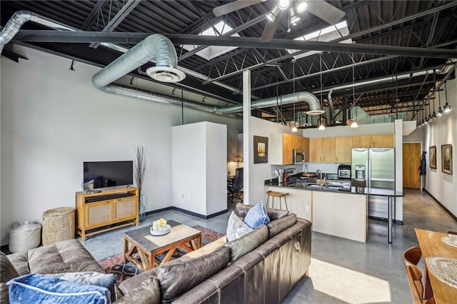 5200 Peachtree Rd Unit 3420, Atlanta, GA 30341 - living room with finished concrete floors, a towering ceiling, and ceiling fan