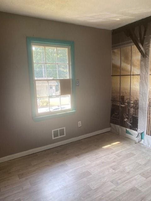 empty room with light wood-type flooring