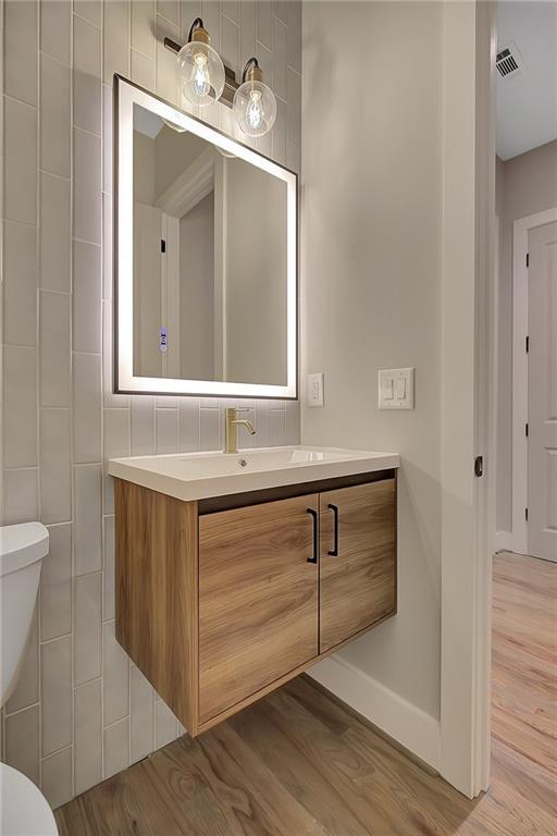 454 Connally St SE, Atlanta, GA 30312 - bathroom featuring vanity and wood finished floors