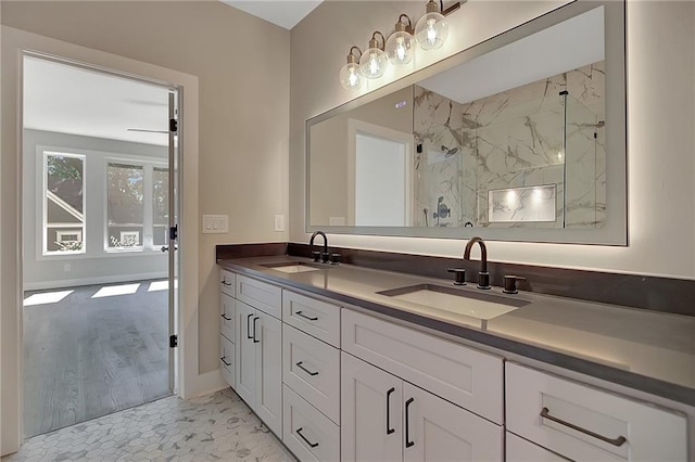 454 Connally St SE, Atlanta, GA 30312 - bathroom featuring double vanity and a marble finish shower
