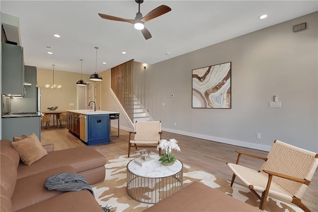 454 Connally St SE, Atlanta, GA 30312 - living area featuring light wood-style flooring, stairway, ceiling fan, and recessed lighting