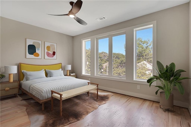 454 Connally St SE, Atlanta, GA 30312 - bedroom with multiple windows, light wood-type flooring, and ceiling fan
