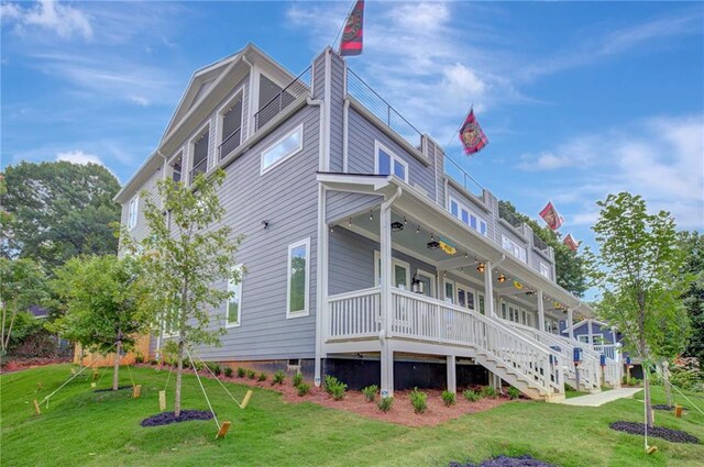 454 Connally St SE, Atlanta, GA 30312 - view of property exterior featuring covered porch, ceiling fan, a lawn, and a chimney