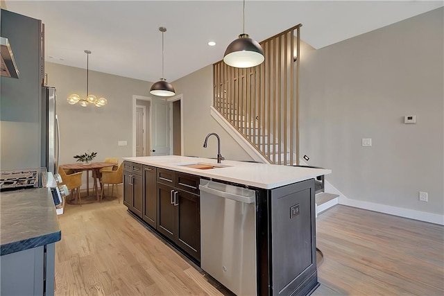 454 Connally St SE, Atlanta, GA 30312 - kitchen featuring dishwasher, light wood finished floors, a kitchen island with sink, and a chandelier