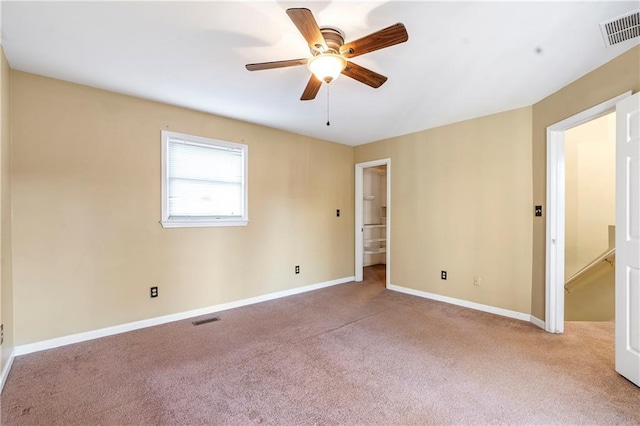 carpeted empty room with ceiling fan