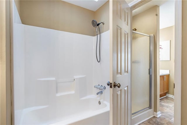 bathroom featuring an enclosed shower and vanity