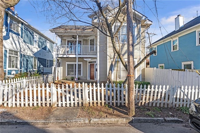 view of front of house featuring a balcony