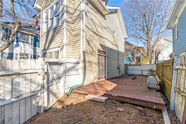 view of home's exterior with a wooden deck