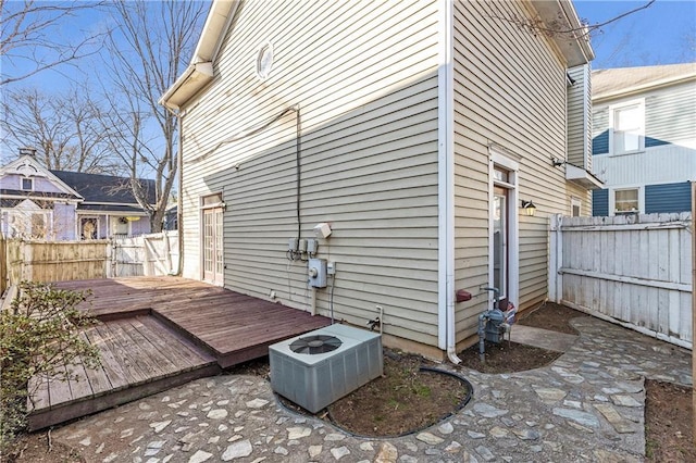 exterior space with a deck and central air condition unit