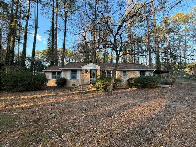 view of front of house with brick siding