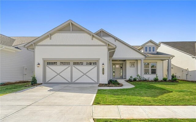 craftsman-style home with a garage and a front yard