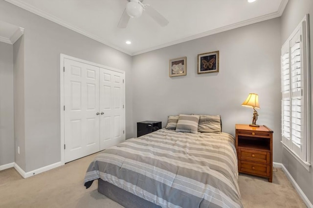 carpeted bedroom featuring baseboards, ceiling fan, ornamental molding, a closet, and recessed lighting