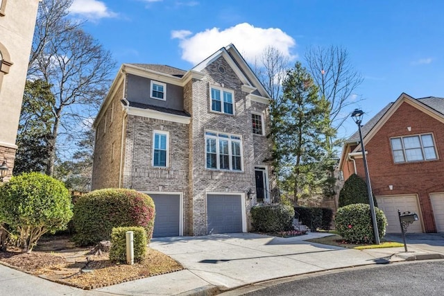 view of front of house featuring brick siding, driveway, and an attached garage