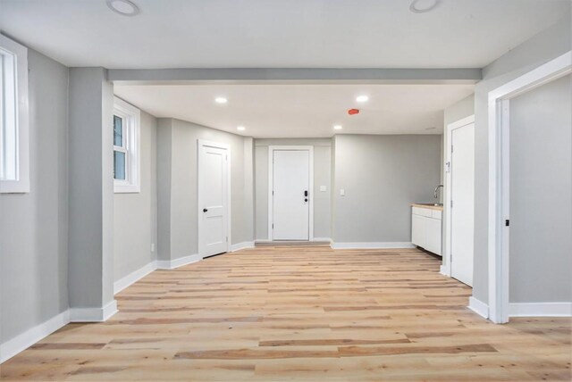 interior space with sink and light hardwood / wood-style flooring