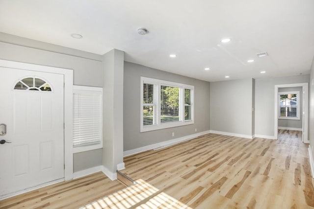 foyer with light hardwood / wood-style floors