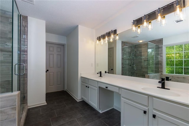 3260 Ridgefair Dr, Cumming, GA 30040 - bathroom featuring a stall shower, double vanity, tile patterned flooring, and baseboards