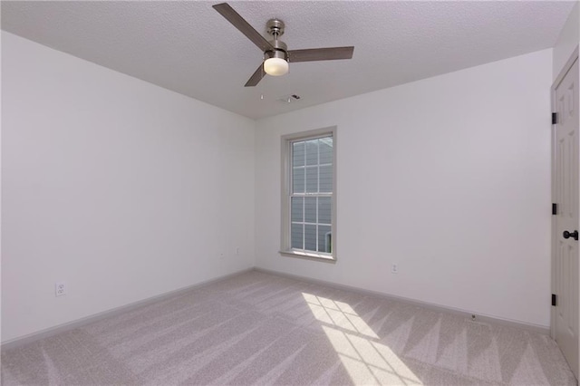 3260 Ridgefair Dr, Cumming, GA 30040 - empty room featuring light carpet, ceiling fan, a textured ceiling, and baseboards