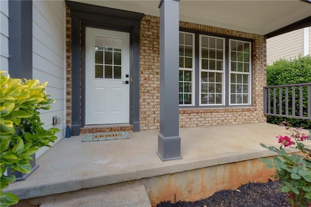 3260 Ridgefair Dr, Cumming, GA 30040 - doorway to property with a porch and brick siding