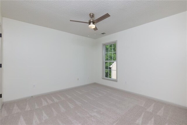 3260 Ridgefair Dr, Cumming, GA 30040 - spare room with carpet floors, ceiling fan, a textured ceiling, and baseboards