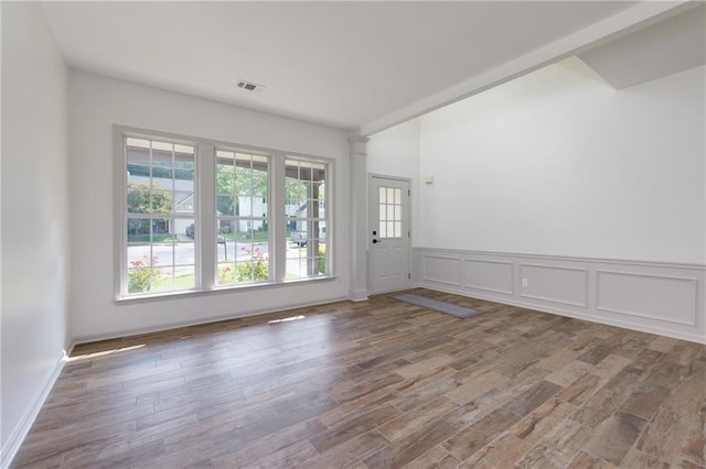 3260 Ridgefair Dr, Cumming, GA 30040 - spare room with wood finished floors and wainscoting