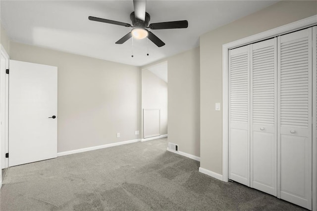 unfurnished bedroom with visible vents, ceiling fan, baseboards, a closet, and dark colored carpet