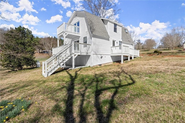 view of property exterior with a balcony, a gambrel roof, a shingled roof, stairs, and a lawn