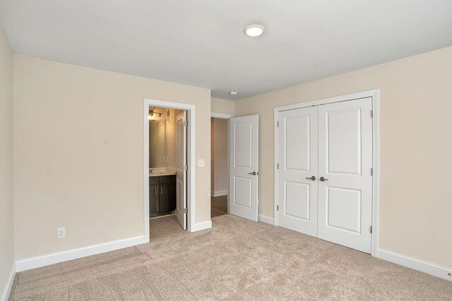 201 Cooper Dr, Mansfield, GA 30055 - unfurnished bedroom with light colored carpet and baseboards