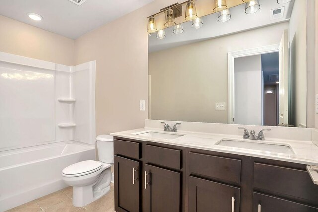201 Cooper Dr, Mansfield, GA 30055 - full bath featuring toilet, double vanity, tile patterned floors, and tub / shower combination