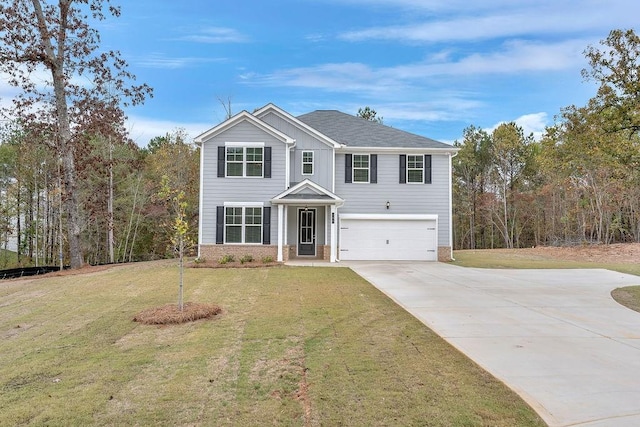 view of front of house with a garage and a front lawn