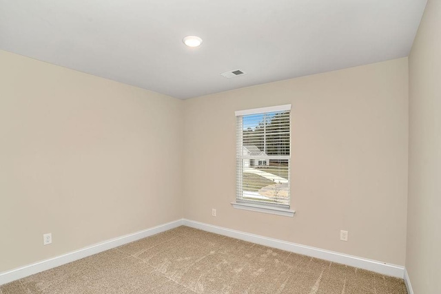 empty room featuring light colored carpet