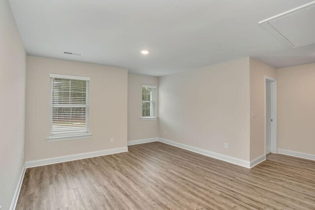 201 Cooper Dr, Mansfield, GA 30055 - unfurnished room with attic access, light wood-style floors, baseboards, and recessed lighting