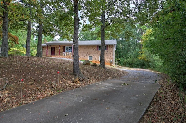 view of side of home featuring brick siding