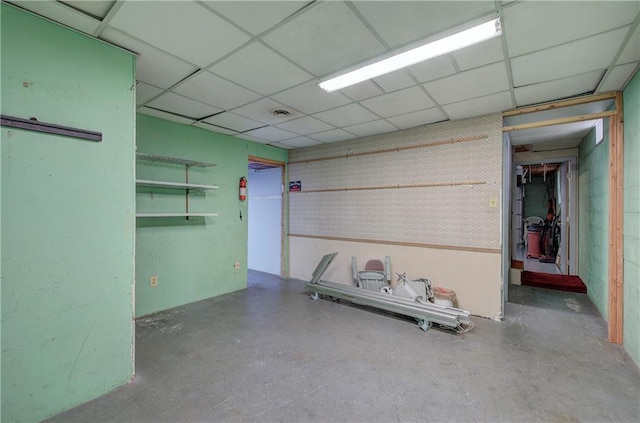 interior space with a paneled ceiling and visible vents