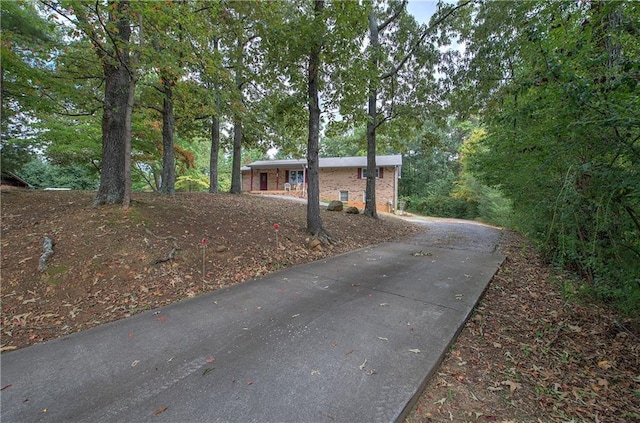 view of side of home with brick siding