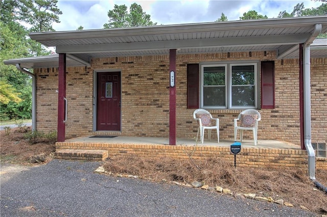 entrance to property with a porch