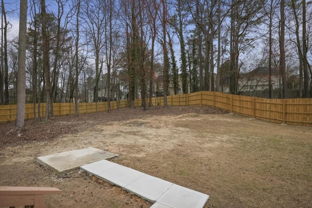 view of yard with a fenced backyard