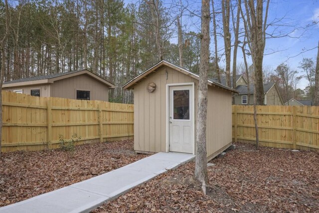 back of property featuring stairway, fence, a deck, and brick siding