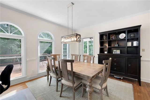 206 Kingsley Way, Woodstock, GA 30188 - dining room with plenty of natural light, ornamental molding, wood-type flooring, a chandelier, and baseboards