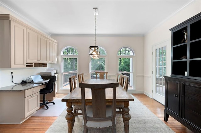 206 Kingsley Way, Woodstock, GA 30188 - dining space featuring light wood-style flooring and ornamental molding