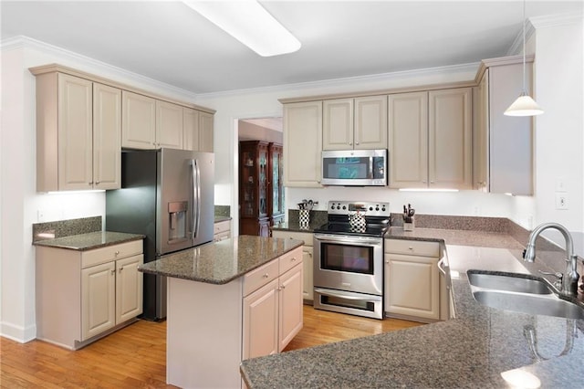 206 Kingsley Way, Woodstock, GA 30188 - kitchen featuring appliances with stainless steel finishes, cream cabinets, a sink, and ornamental molding