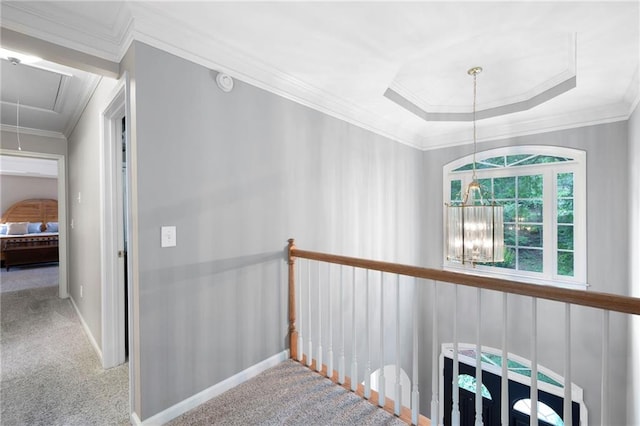 206 Kingsley Way, Woodstock, GA 30188 - corridor featuring attic access, carpet floors, crown molding, a raised ceiling, and baseboards