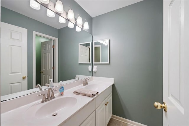 206 Kingsley Way, Woodstock, GA 30188 - bathroom featuring double vanity, tile patterned flooring, and baseboards