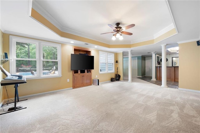 206 Kingsley Way, Woodstock, GA 30188 - unfurnished living room with decorative columns, a tray ceiling, crown molding, carpet flooring, and a ceiling fan