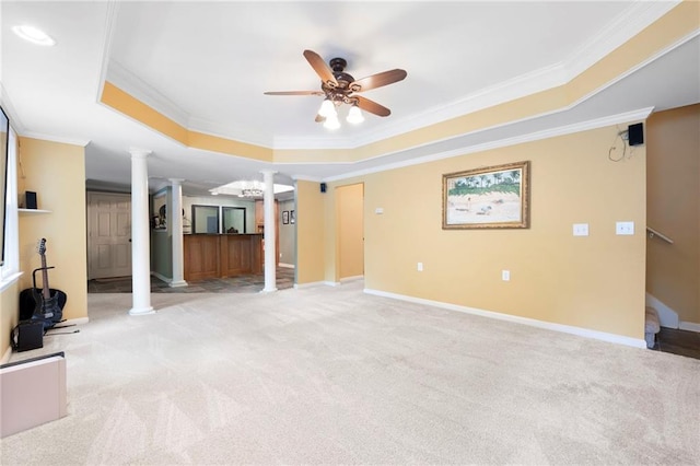 206 Kingsley Way, Woodstock, GA 30188 - unfurnished living room with decorative columns, a raised ceiling, crown molding, light carpet, and a ceiling fan