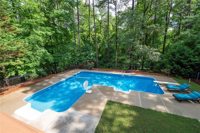 206 Kingsley Way, Woodstock, GA 30188 - view of pool with a fenced backyard, a diving board, a patio, and a forest view