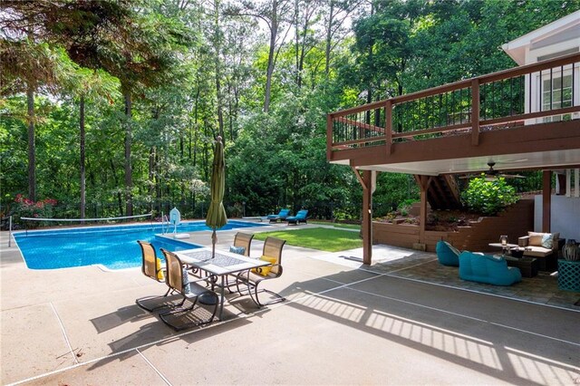 206 Kingsley Way, Woodstock, GA 30188 - swimming pool with a ceiling fan, a patio area, outdoor lounge area, and view of wooded area